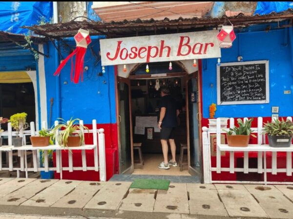 Joseph Bar Goa: A 1970s Goan Bar Preserving True Old-School Charm Joseph Bar Goa interior with wooden shutters and blue walls