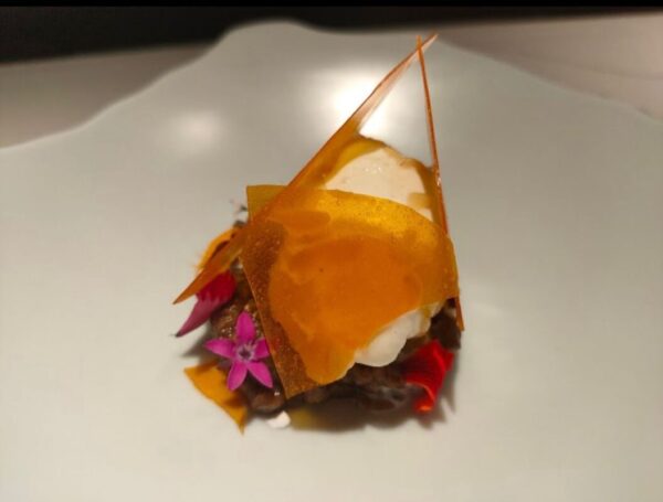 Chef plating a seasonal dish at Farmlore Bangalore