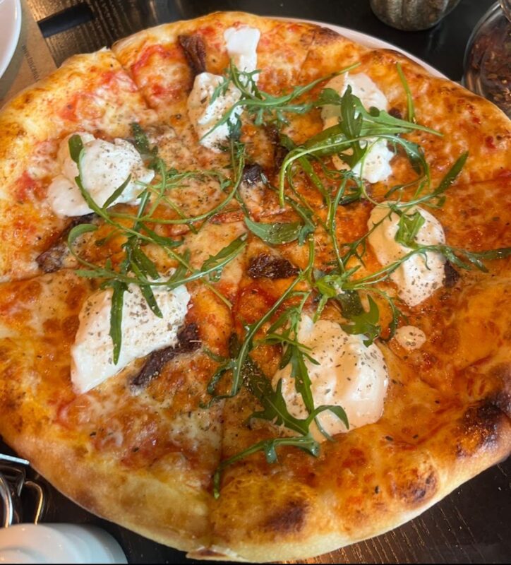 Wood-fired pizza being prepared at Toscano in UB City