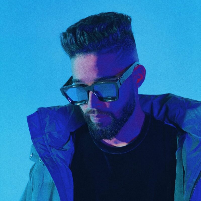 AP Dhillon performing on stage at an international music festival