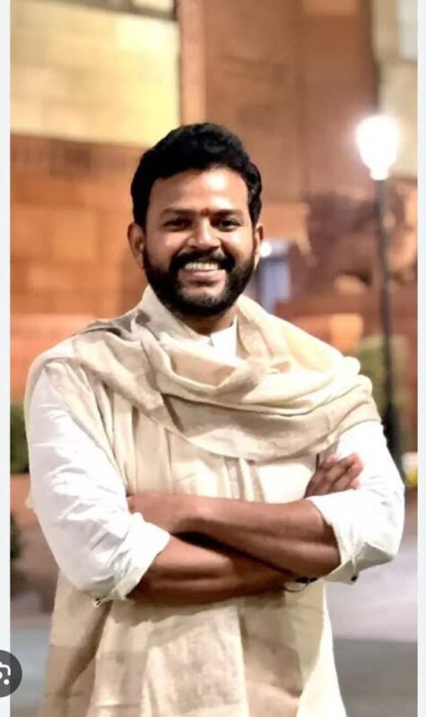 IndiGo flight cancellation notice at a crowded airport terminal