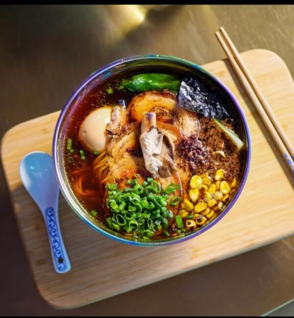 Live cooking station with chef preparing Korean fried chicken