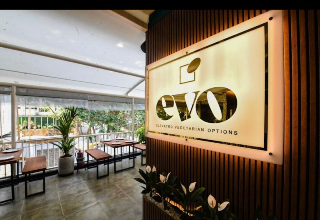 Evo is a Vibe: A Refined Dining Experience in Bangalore Couple enjoying a shared pasta dish at Evo Restaurant Bangalore
