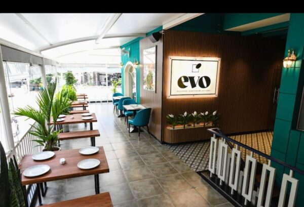 Chef preparing a noodle bowl at the open kitchen in Evo Restaurant