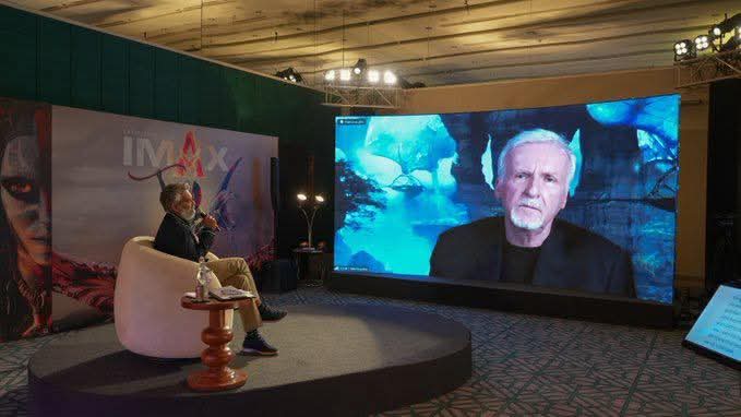 James Cameron pointing at a visual from Avatar: Fire and Ash while explaining it to Rajamouli