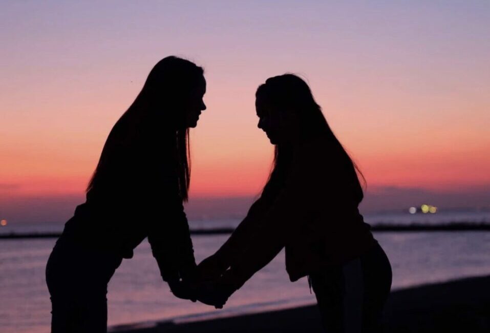 Two close friends sharing a heartfelt conversation, symbolizing the friendship over romance trend.