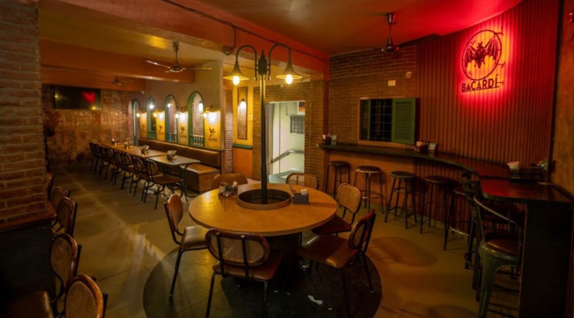 Old-School Bar in a Prime Location: The Timeless Appeal of Ching Lung Classic wooden interior and dim lighting of Ching Lung Bar Bangalore on Brigade Road.