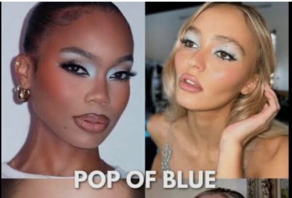 Model showcasing the 2026 makeup trends with glowing skin and a soft metallic eyelid accent.