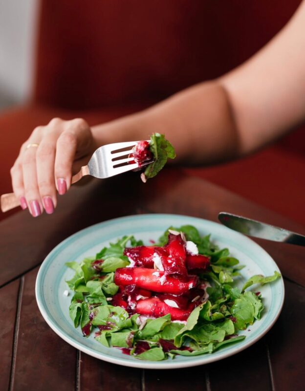 Go Native: A Celebration of Indian Flavours Chef at Go Native Restaurant preparing a dish with fresh, local ingredients.