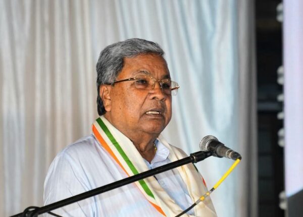 Conflicting Signals on Power-Sharing Add to Karnataka Political Buzz Deputy Chief Minister DK Shivakumar speaking at an event, hinting at internal party agreements.