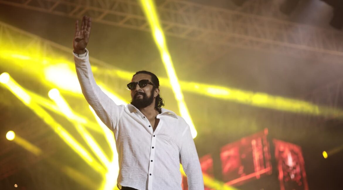 Kiccha Sudeep addressing the media at the Mark event, commenting on the ongoing feud.