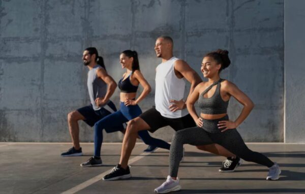 Group of individuals participating in an outdoor fitness bootcamp in India, representing 2026 health resolutions.
