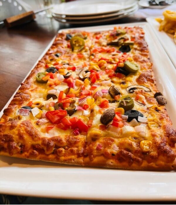 Close-up of a gourmet salad or pasta dish from the Green Theory Cafe menu.