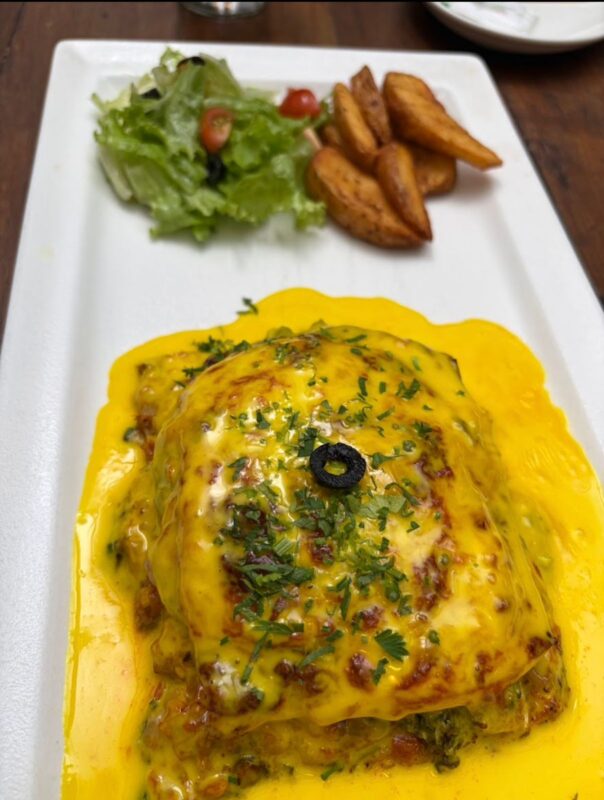 A quiet corner seating area at Green Theory Cafe, perfect for work or conversation.