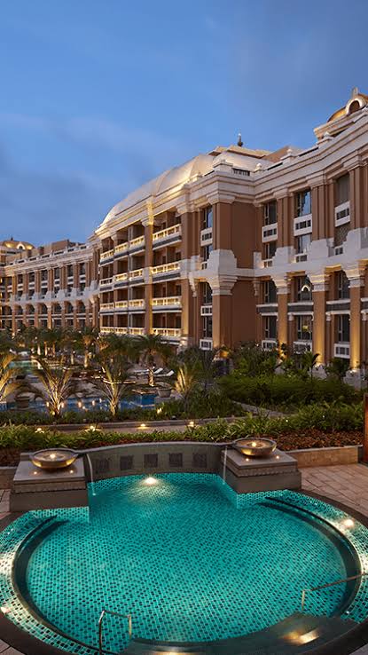 Jeet Adani announcing the hotel business expansion plans at a corporate event.