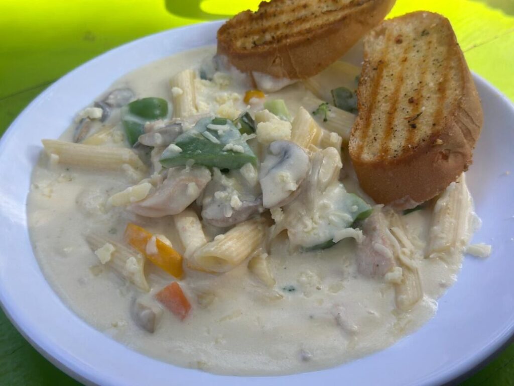 A hot cup of coffee with a scenic Nandi Hills view from Silver Oak Cafe.