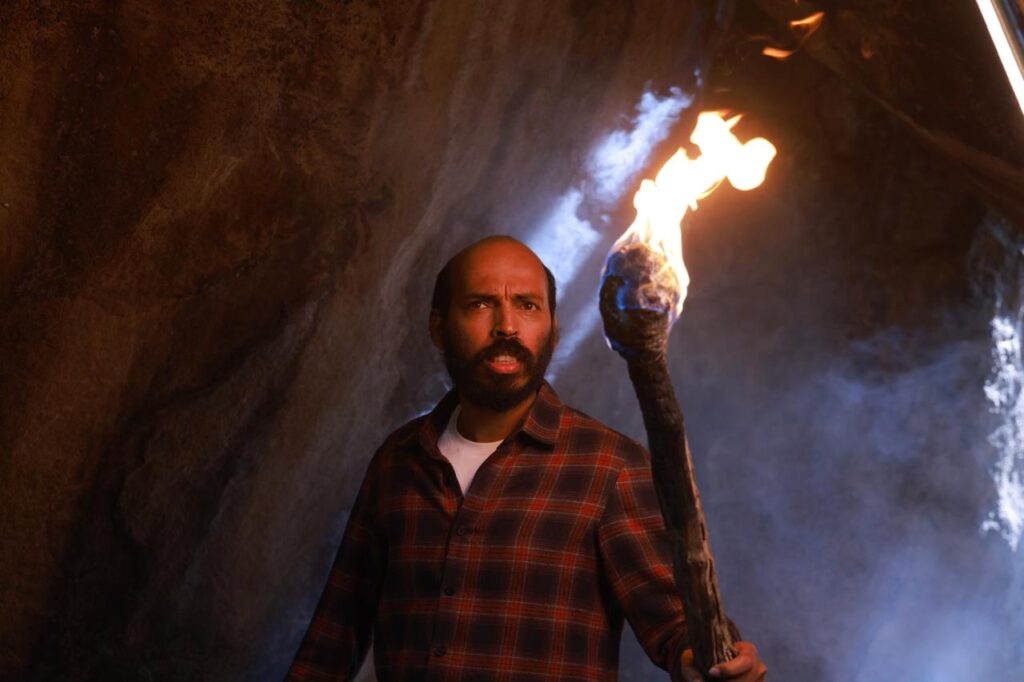 A dark, atmospheric still from the Rakkasapuradhol teaser showing the village.