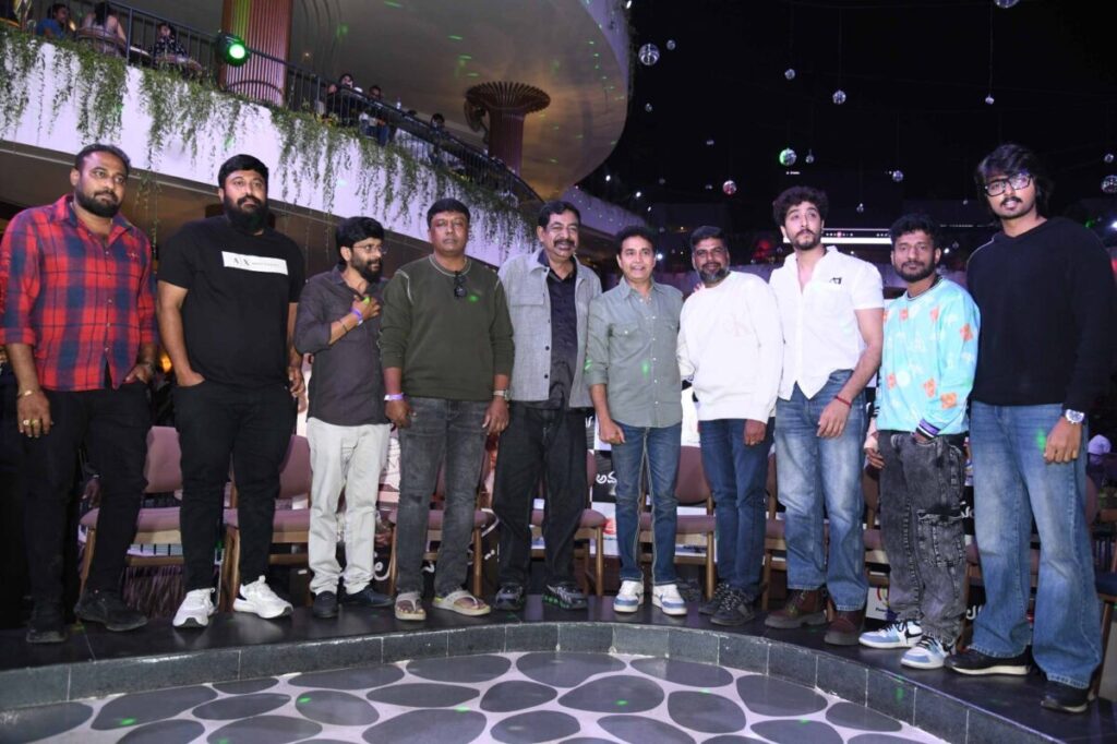 Actor Sharan singing or addressing the media at the "Amalu" song launch event.