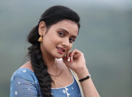 A vibrant promo still featuring Vanditha and Chikkanna from the Lakshmiputra film.