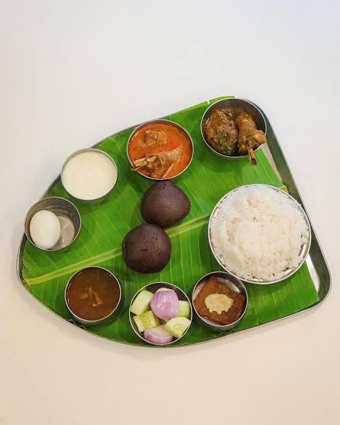 Siddaramaiah Nati Koli Sambar Feast Celebration Honors His Record Tenure Party workers cooking large pots of traditional nati koli sambar at the feast event.