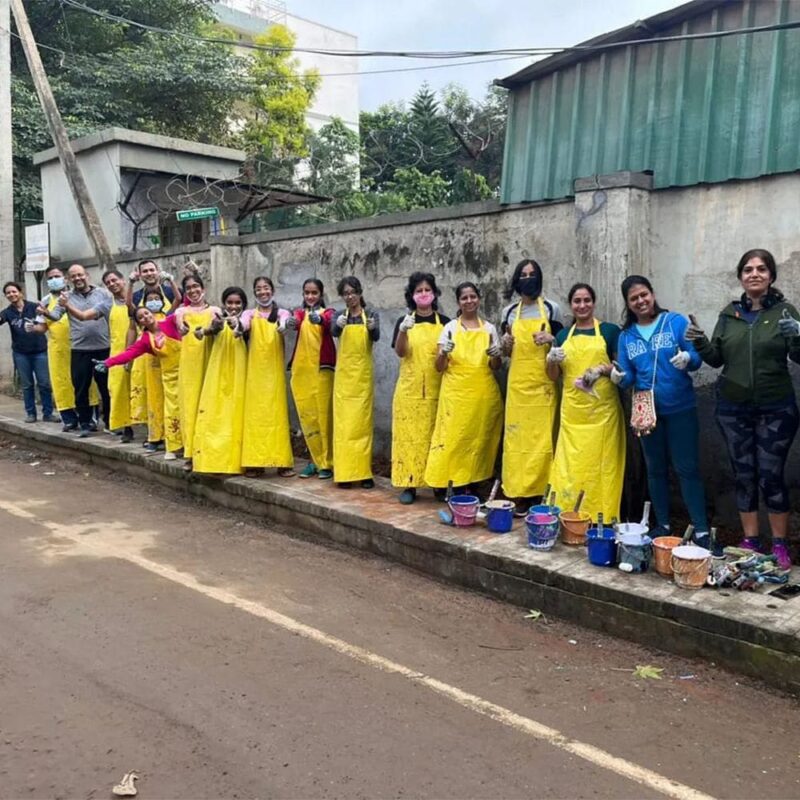 A coordinator from The Ugly Indian guiding students during the clean-up activity.