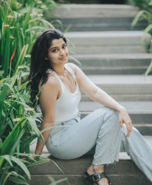 Aishani Shetty announcing her directorial debut, Kaajana, in a promotional photo.